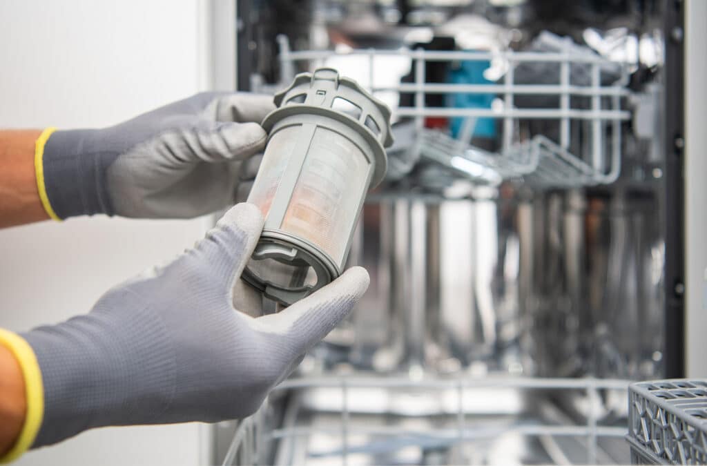 Technician Checking On Modern dishwasher filter