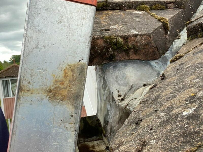 How to Clean Gutters from the Ground With a Ladder