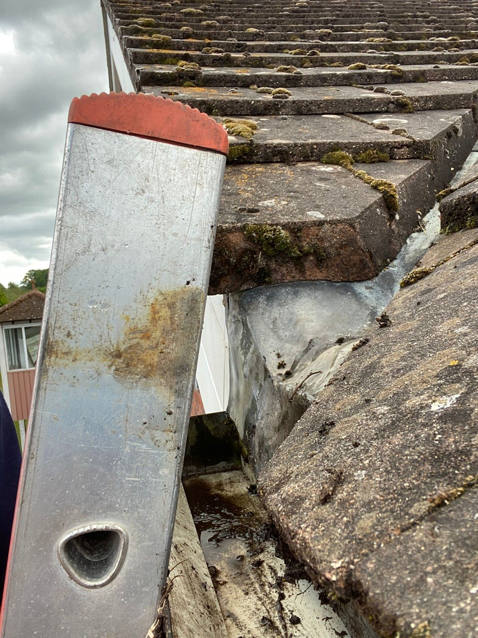 How to Clean Gutters from the Ground With a Ladder