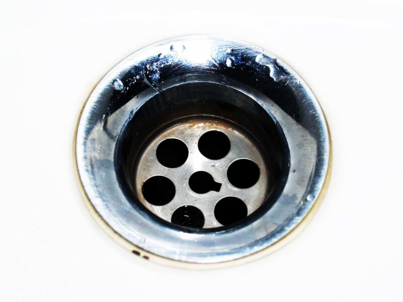 How do I fix the problem of a drain smell in my house?